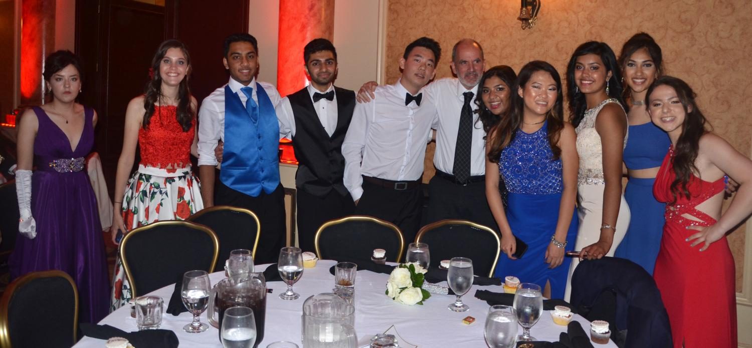 Mr. Crozier gathers with students at the senior prom in 2017