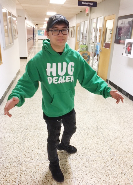 Junior Jacob Vozzi is a "hug dealer." He bought the green hoodie for his debate in English III Honors. 