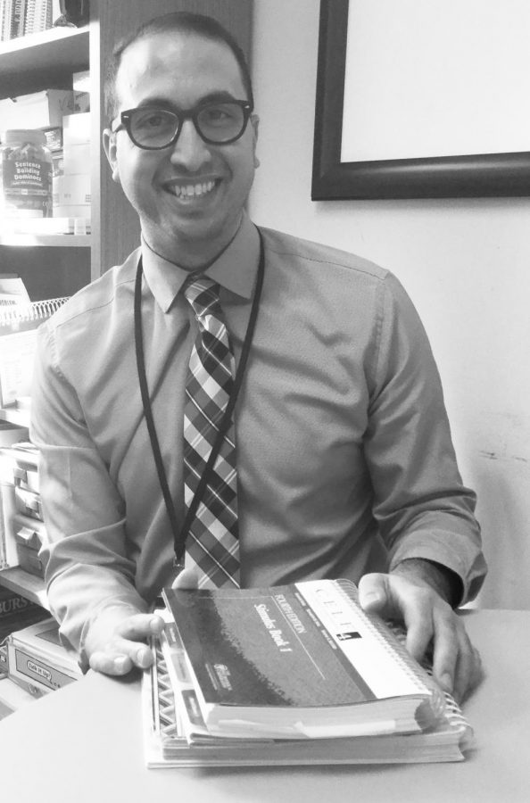Mr. Bodine smiles in his office.