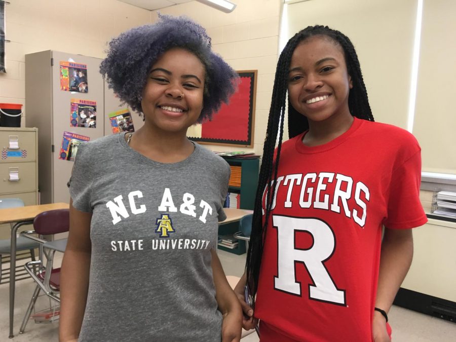Aziarah Jones and Aliyah El-Muhammad gesture to their college shirts.