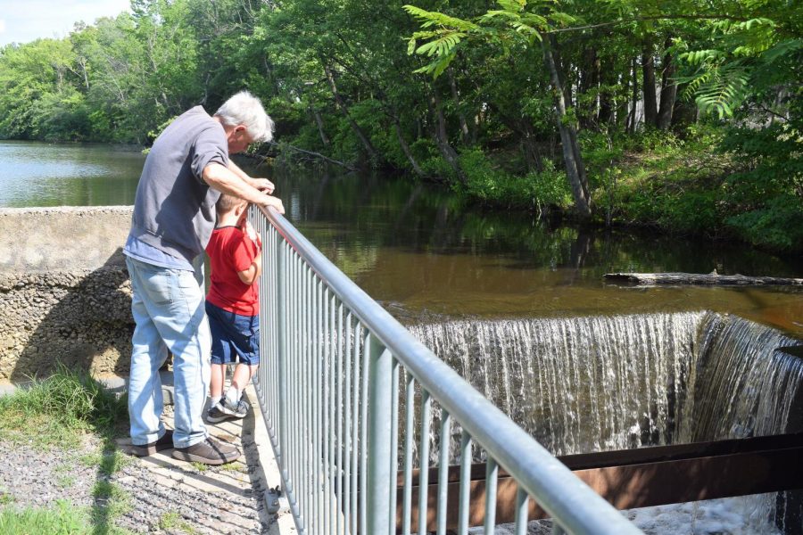 Max Hawkins shows Matt Gell (in red) the dam at Kirkwood Lake that starts the Cooper River