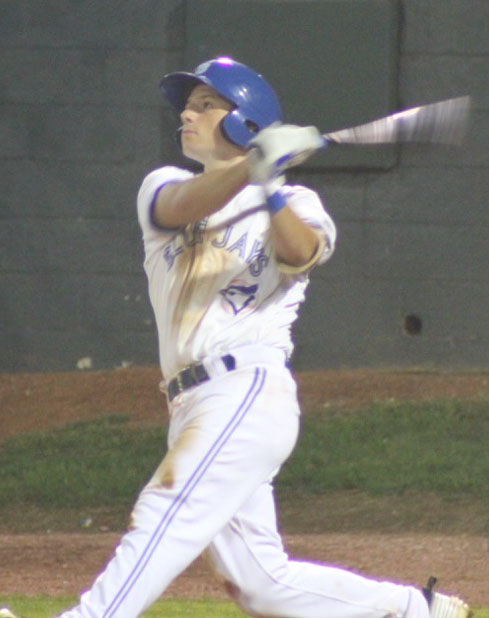 Schneider takes a swing in a minor league game. 