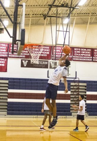 Boys basketball battles in a tough division
