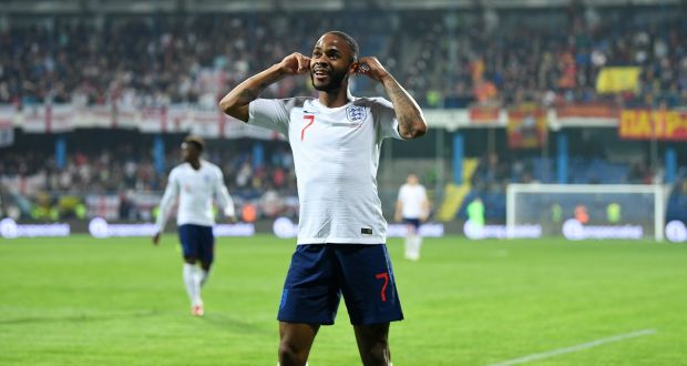 England forward Raheem Sterling celebrates after scoring a goal in a 5-1 win against Montenegro in March 2019. He had been suffering from racial abuse by fans all game.