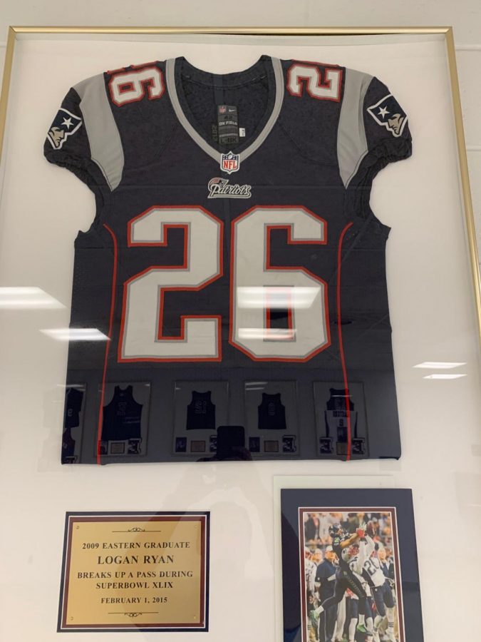 Logan Ryans Patriotss #26 jersey hangs in the main lobby of his alma mater.