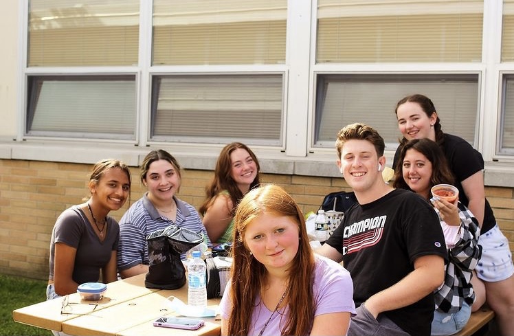 From Left- Seniors Lauren Kenselaar, Chloe Spence, Sarah Geary, Katie Smith, Nick Vitale, Giuliana Bruzzese, and Cailyn Gallagher pose in the Senior Courtyard.