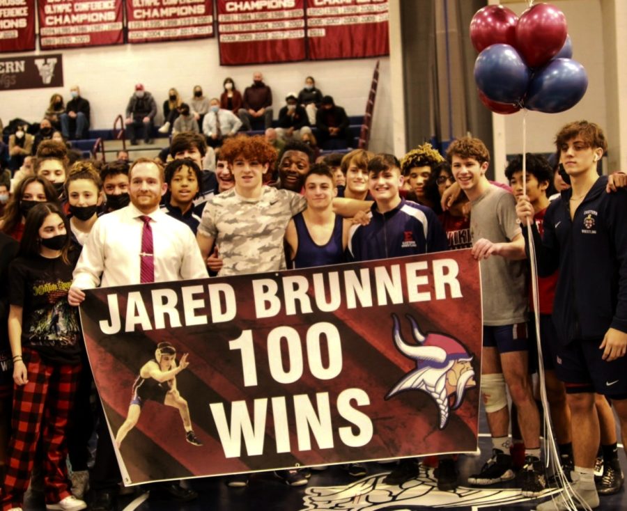 Jared Brunner celebrates with his teammates and coaches, following his hundredth victory on January 21st, 2022 at Easterns Gym 4.