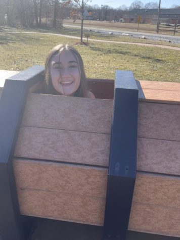 Junior Zoey Blackman plays in a barrel in Sawmill Park in Buena, New Jersey.