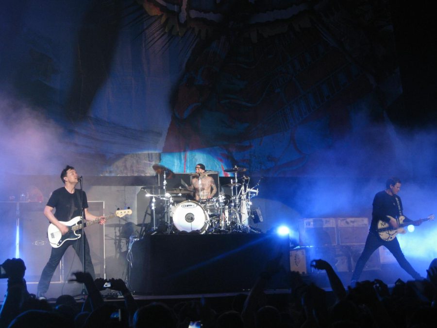 Blink-182 founding members performing in 2011 at the Valley View Casino Center in San Diego. Left to right: co-vocalist/bassist Mark Hoppus, drummer Travis Barker, and co-vocalist/guitarist Tom DeLonge.
Credit: Wikimedia Commons 