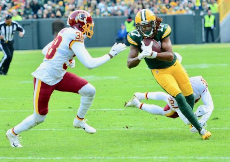 Davante adams is in some trouble for shoving a photographer after a game.