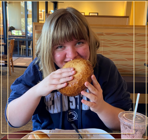 Opinion editor Kaitlin Swift pictured at Panera Bread on a lovely April afternoon, viciously massacring a Panera Bread bowl with delight.