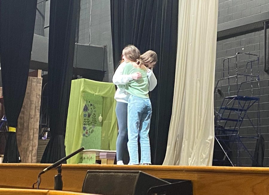 Ava Connelly and Zoe Blackman embrace on set during the rehearsal of Frozen the Broadway Musical.