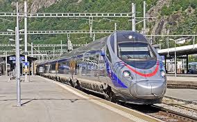 Amtrak Train pulls into  station to pick up eager passengers