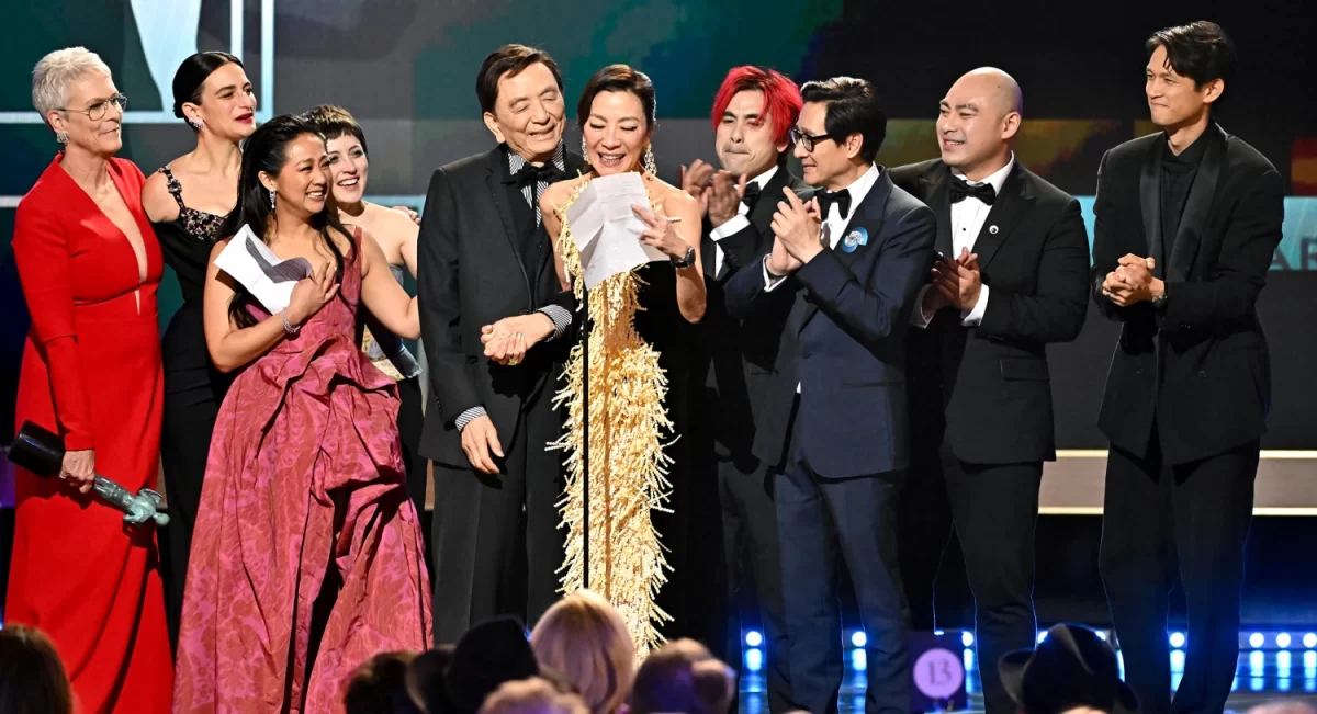 Cast and crew of Everything Everywhere All At Once pose after winning outstanding cast performance at 2023 Screen Actors Guild awards.
